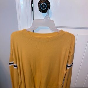 yellow long sleeve with striped on arms